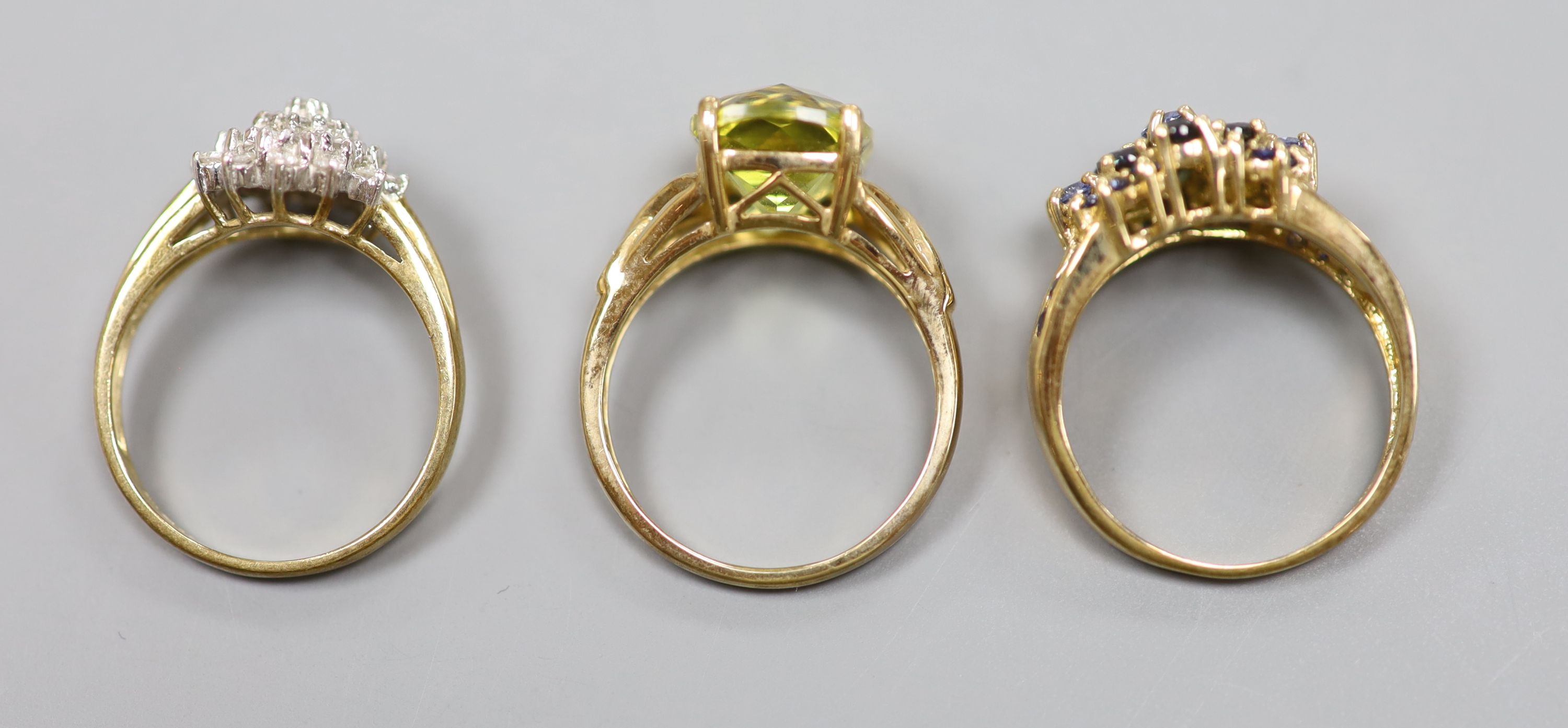 A diamond and 9ct gold cluster ring and two other 9k rings